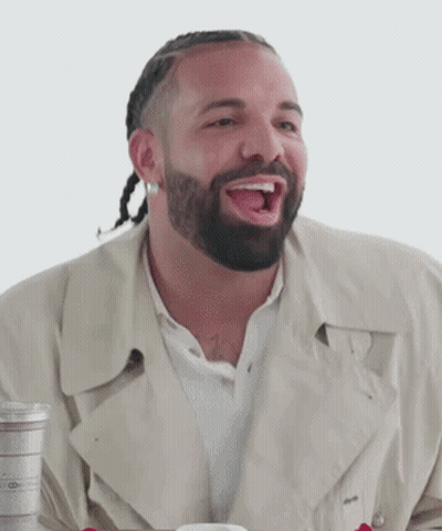 Man With Beard Sitting In Stadium Looking At Phone GIF