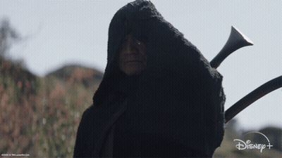 Man With Beard Sitting Next To R2D2 Robot GIF