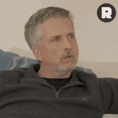 Man With Beard Sitting On Couch GIF