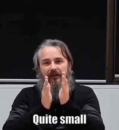 Man With Beard Sitting With Hands Folded Saying Quite Small GIF