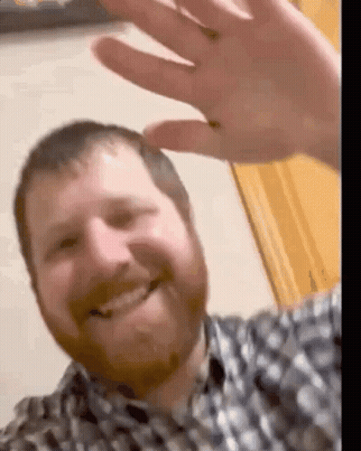 Man With Beard Smiling And Waving GIF