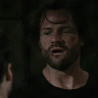 Man With Beard Smiling At Another Man GIF