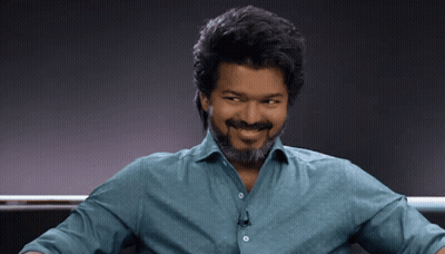 Man With Beard Smiling In Blue Shirt GIF