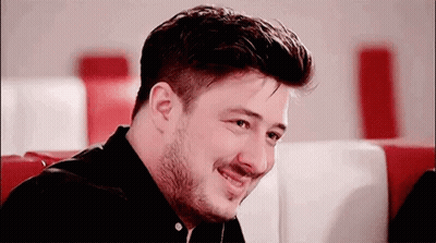 Man With Beard Smiling In Diner GIF
