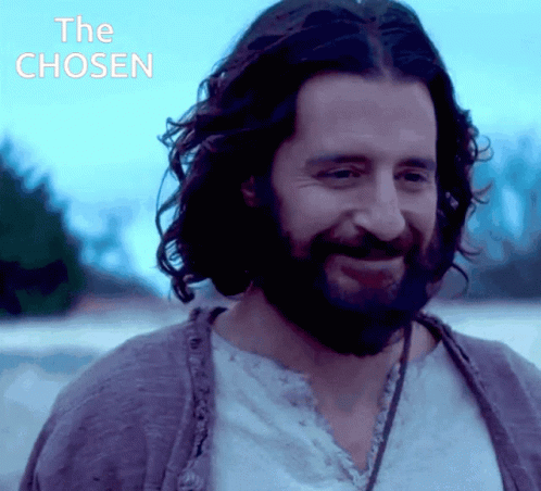 Man With Beard Smiling In Front Of The Chosen Sign GIF