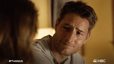Man With Beard Smiling Next To Woman NBC Logo GIF