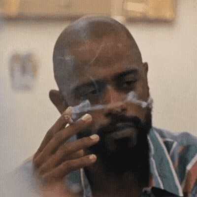 Man With Beard Smoking Cigarette And Bandage GIF