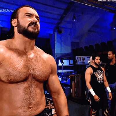 Man With Beard Standing Before Cast Sign GIF