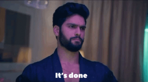 Man With Beard Standing Before Its Done Sign GIF