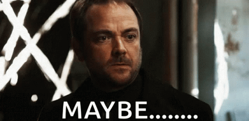 Man With Beard Standing Before Maybe Sign GIF
