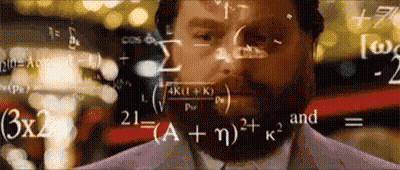 Man With Beard Standing In Front Of Chalkboard With Math Equations GIF