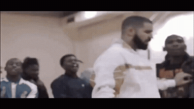 Man With Beard Standing In Front Of Crowd GIF