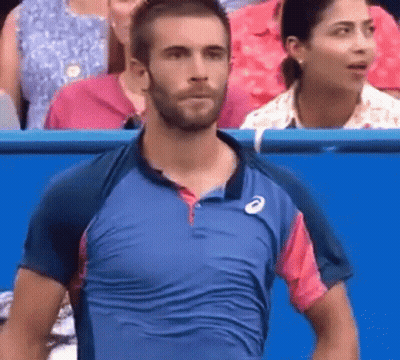 Man With Beard Standing In Front Of Crowd GIF