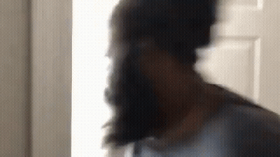 Man With Beard Standing in Front of Door