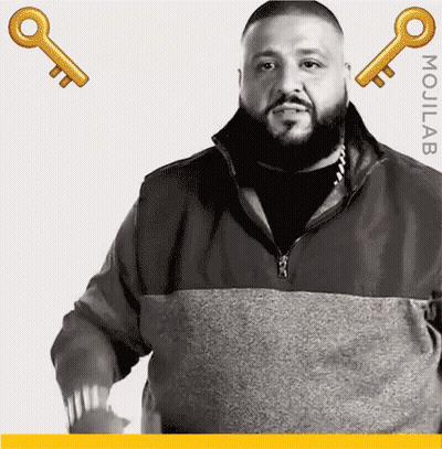 Man With Beard Standing In Front Of Keys GIF