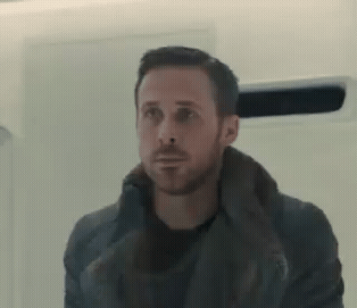 Man With Beard Standing in Front of Mirror