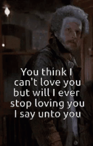 Man With Beard Standing In Front Of Neva Sign GIF