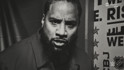 Man With Beard Standing In Front Of Sign Saying We GIF