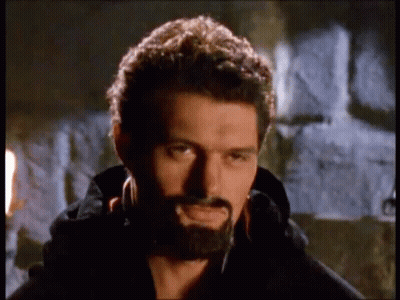 Man With Beard Standing In Front Of Stone Wall GIF