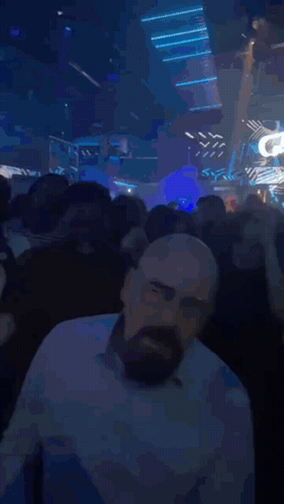 Man With Beard Standing In Front Of Taj Sign GIF