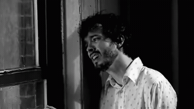 Man With Beard Standing In Front Of Window GIF