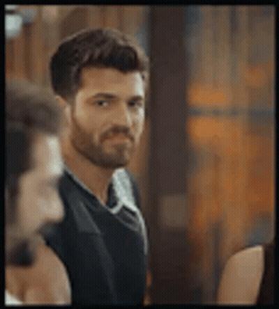 Man With Beard Standing Next To Woman GIF