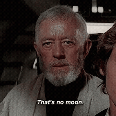 Man With Beard Standing Next To Woman Says That's No Moon GIF