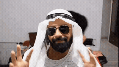 Man With Beard Sunglasses White Turban Making Peace Sign GIF