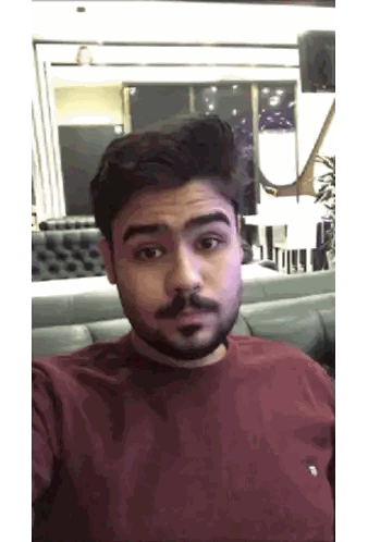 Man With Beard Taking Selfie In Room