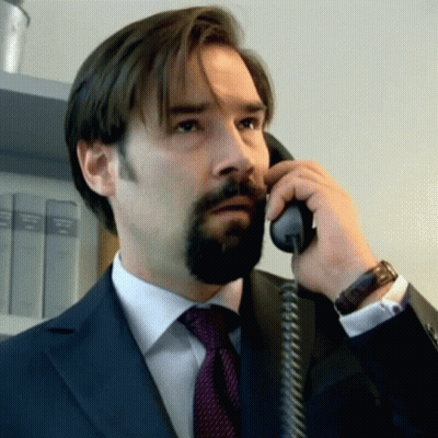 Man With Beard Talking On Phone GIF