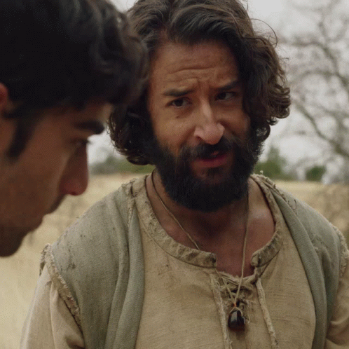 Man With Beard Talking To Another Man In Desert GIF