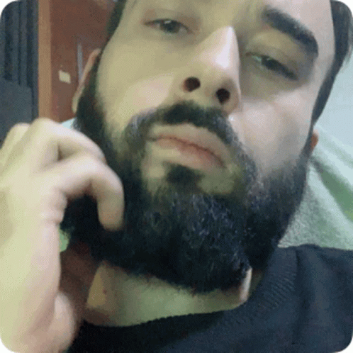 Man With Beard Touching Face GIF