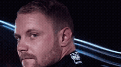 Man With Beard Wearing Black Shirt With FIA On Collar GIF