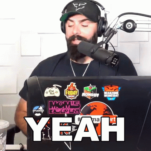 Man With Beard Wearing EA Hat And Headphones GIF