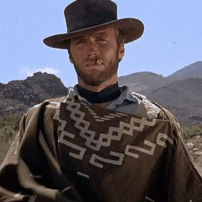 Man With Beard Wearing Geometric Poncho GIF