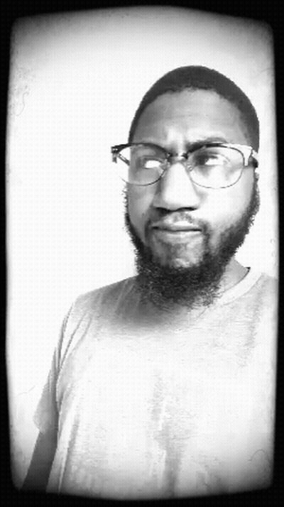 Man With Beard Wearing Glasses And Grey Shirt GIF