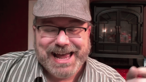 Man With Beard Wearing Glasses And Hat GIF