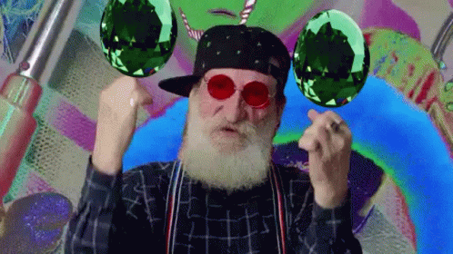 Man With Beard Wearing Hat And Sunglasses Holding Two Green Balls GIF