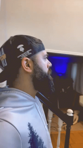 Man With Beard Wearing Hat That Says A Bathing Ape GIF