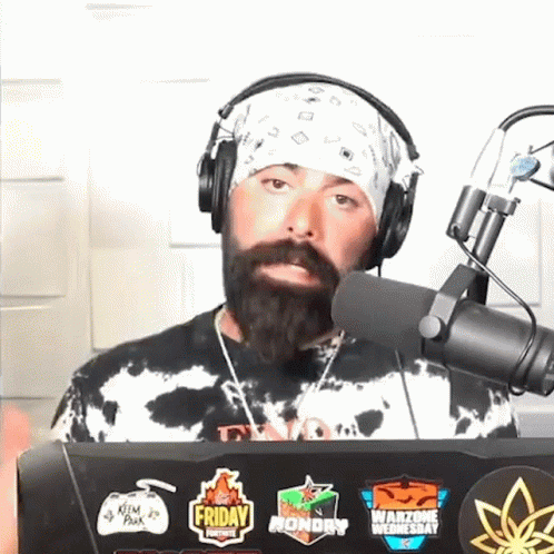 Man With Beard Wearing Headphones And Bandana In Front Of Microphone GIF