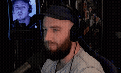 Man With Beard Wearing Headphones and Hat
