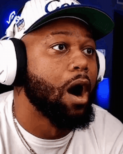 Man With Beard Wearing Headphones And Hat Making Funny Face GIF