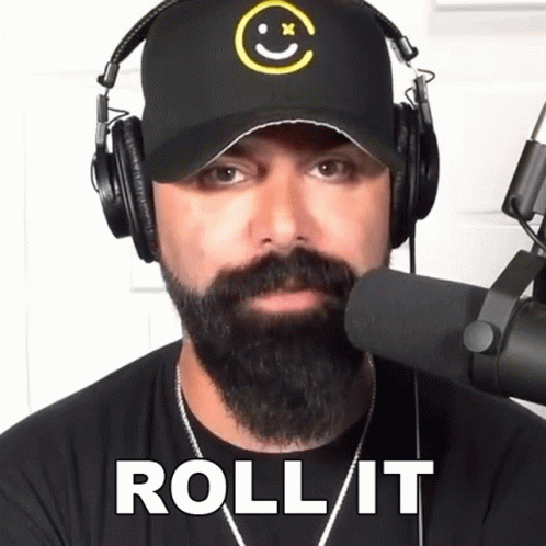 Man With Beard Wearing Headphones And Hat Roll It GIF
