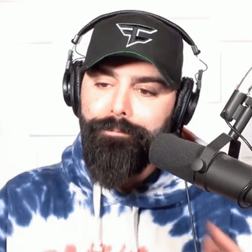 Man With Beard Wearing Headphones And Hat That Says Sg GIF