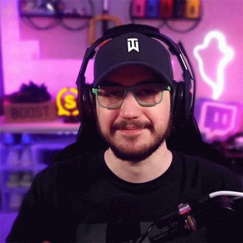 Man With Beard Wearing Headphones And Hat With Letter I GIF