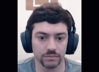 Man With Beard Wearing Headphones Looking At Camera GIF