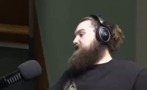 Man With Beard Wearing Headphones Talking Into Microphone GIF