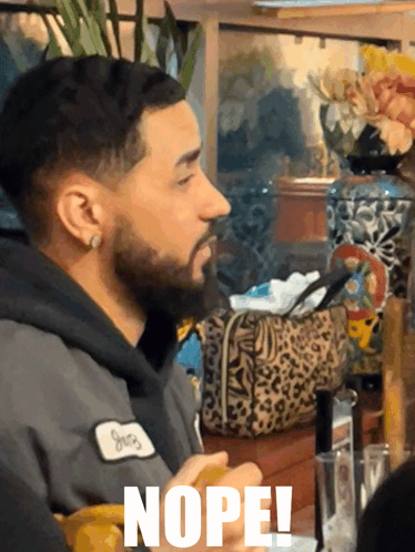 Man With Beard Wearing Nope Patch GIF