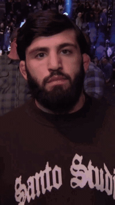 Man With Beard Wearing Santo Stud Shirt GIF