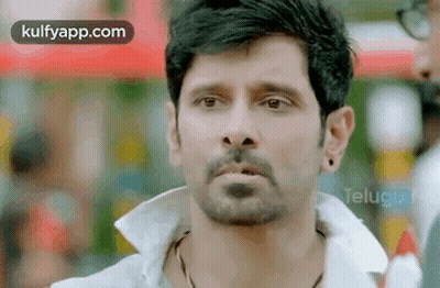 Man With Beard Wearing White Shirt And Earrings GIF